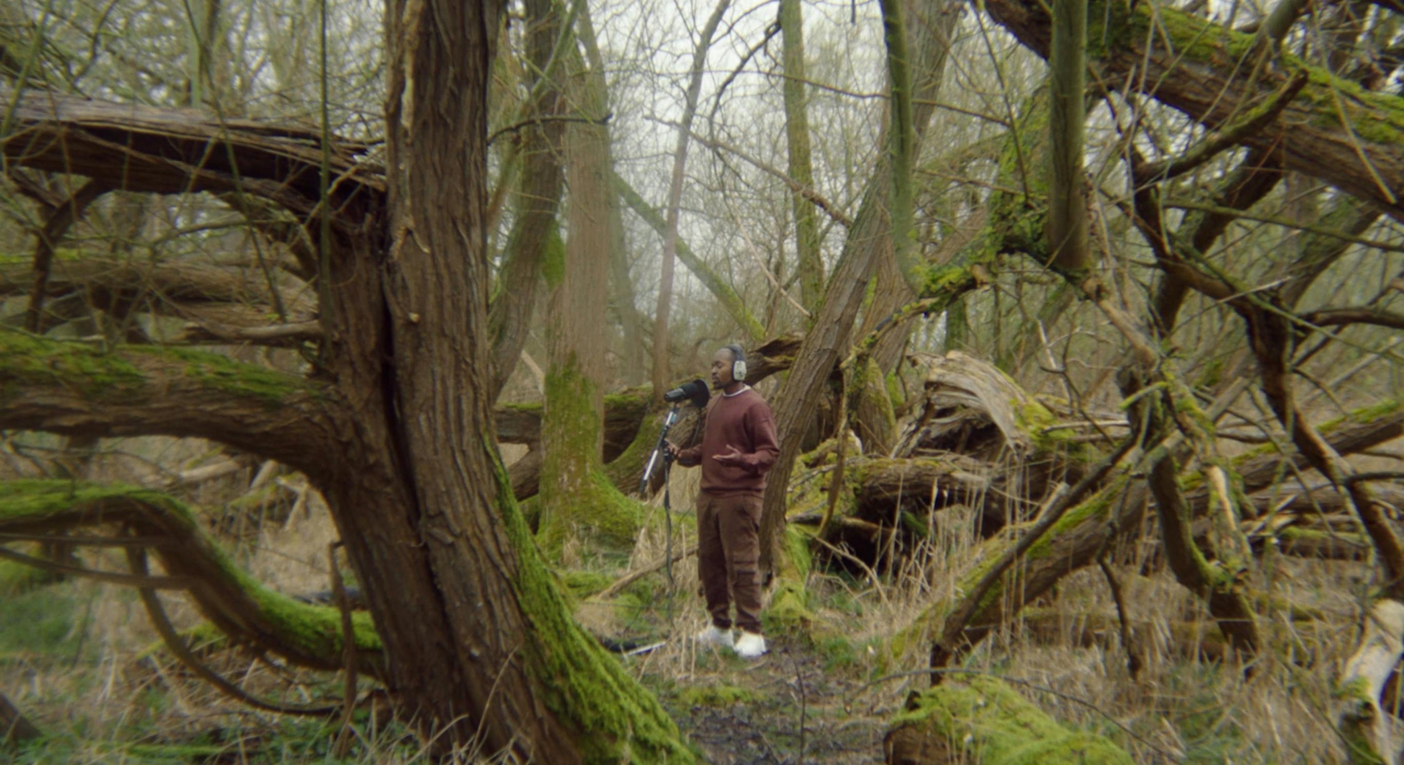 Suli Breaks performing spoken word poetry live in nature